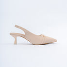 Cream pumps for women with cushioned footbed, side view