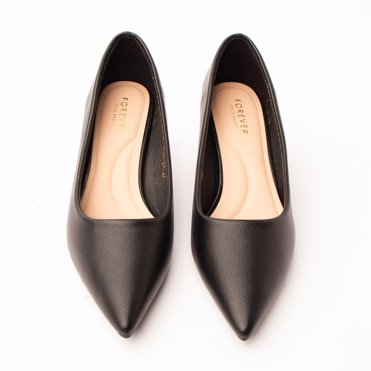 Black pointed kitten heels styled for everyday wear