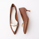 Brown chain link pumps for women, a gold faceted chain-link plate rides an ivory vamp band that flows into a matching ivory toe panel on a tan brown upper, finished with a flared spool kitten heel capped in natural beige, a beige sole edge and a white padded footbed