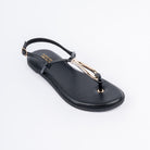 Black flat sandals styled for casual wear