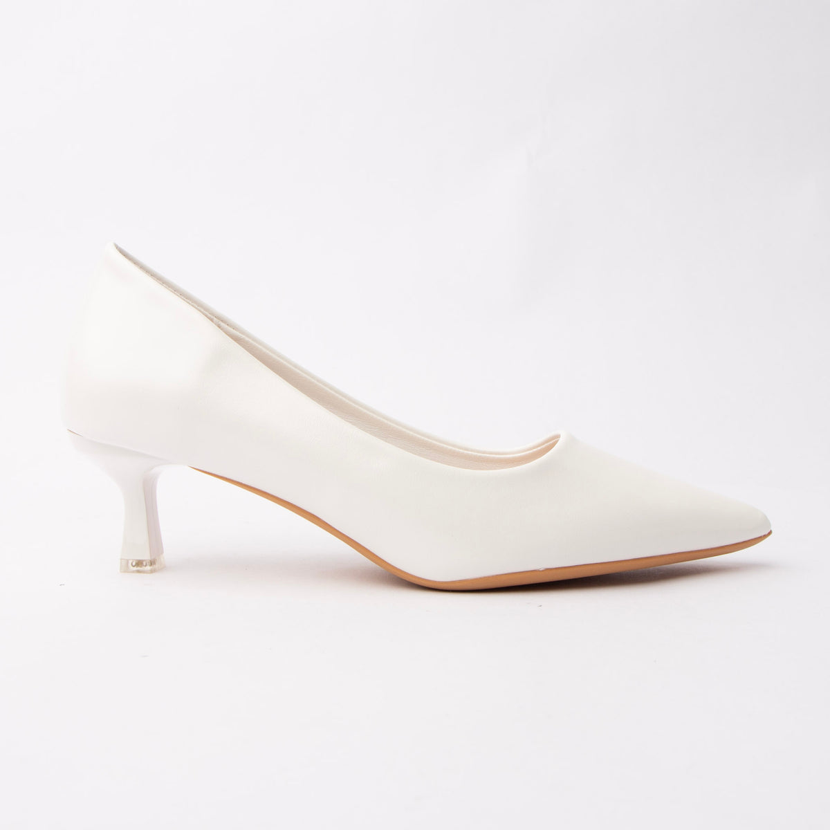 White pointed court shoes for women, a soft chalk-white pointed court reading as a faintly warm off-white, on a sculpted kitten heel finished with a pale metallic tip cap over a natural tan sole edge