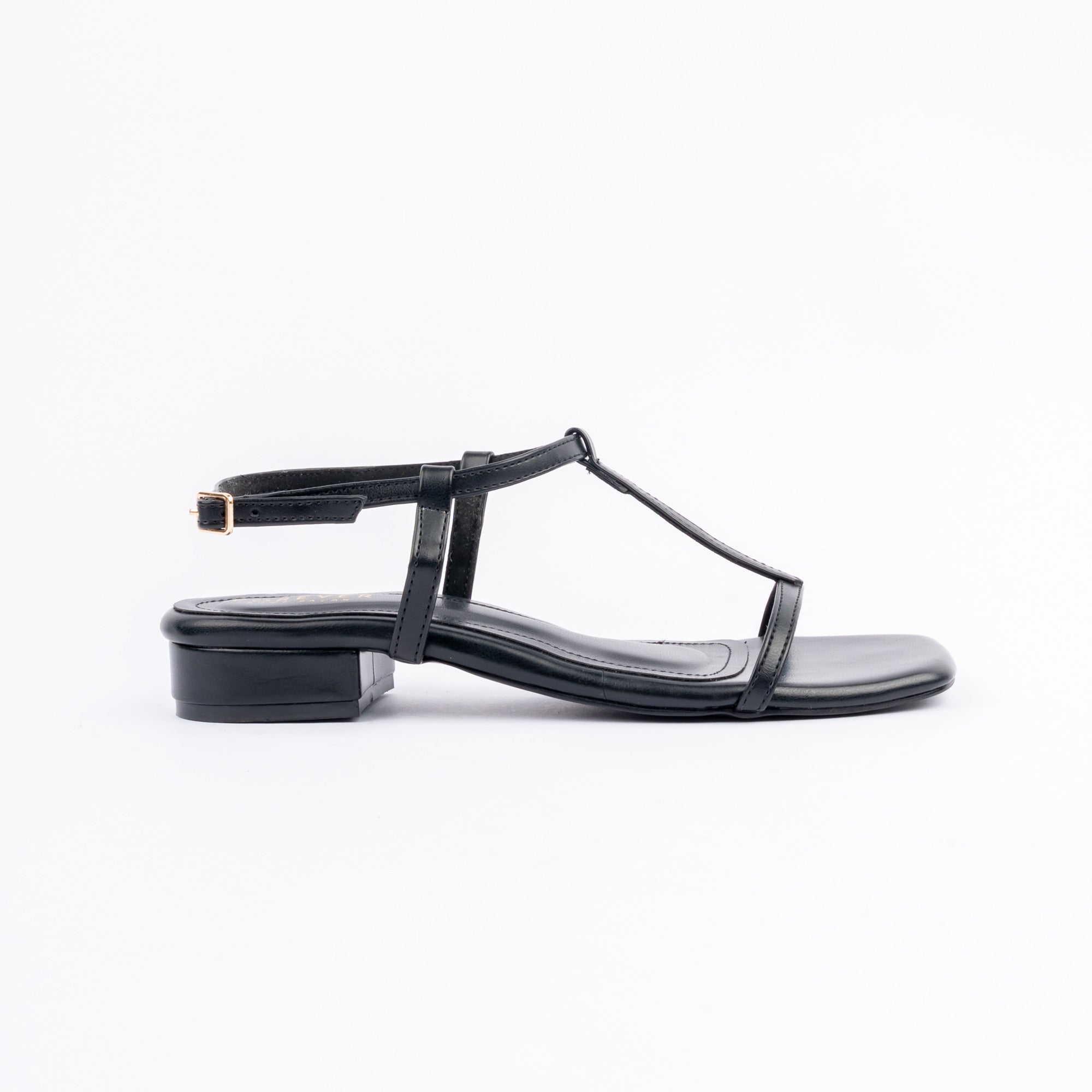 Black block heel sandals for women, a slim T-bar running from a single toe band up to a gold pin-buckle ankle strap, glossy straps on a squared-off footbed and a low block heel