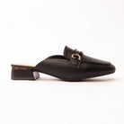 Black horsebit loafer mules for women, a matte black pebble-grain loafer mule with a polished gold horsebit link laid across the vamp, a moccasin apron seam round the square toe and a low block heel banded in gold above a nude padded footbed