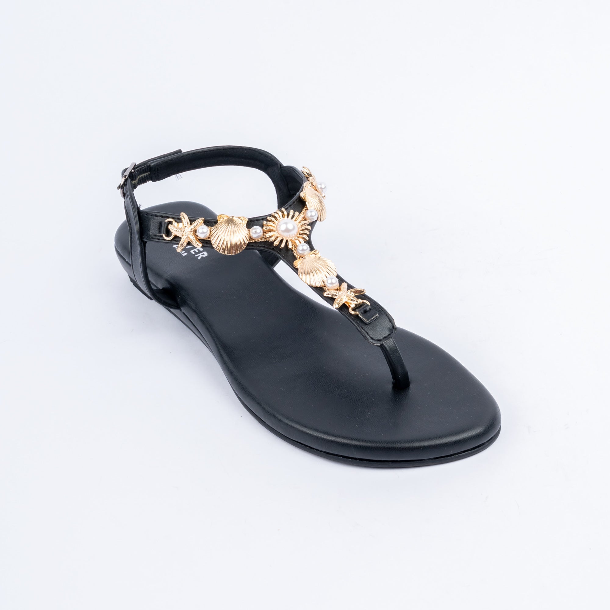 Black flat sandals styled for party wear