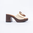 Beige platform heel mules styled for casual wear