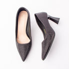 Black rhinestone block heel pumps for women, charcoal satin is densely set with tonal black rhinestones that pack the pointed toe and thin out across the counter, rising to a curved topline above a glossy flared block heel and a padded ivory footbed
