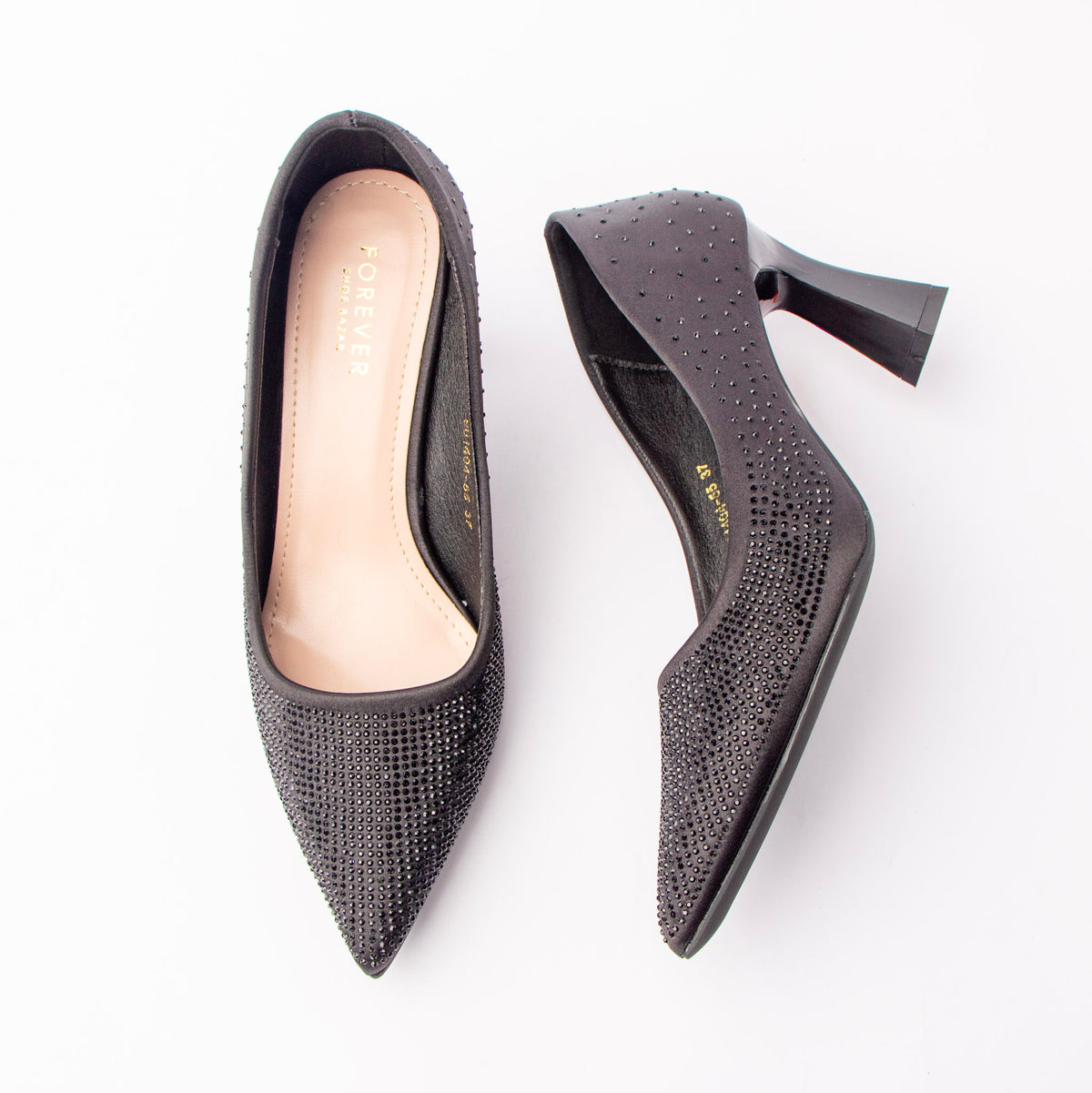 Black rhinestone block heel pumps for women, charcoal satin is densely set with tonal black rhinestones that pack the pointed toe and thin out across the counter, rising to a curved topline above a glossy flared block heel and a padded ivory footbed