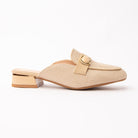 Beige woven loafer mules for women, a pale cream basketweave loafer mule bound in tonal cream, with a gold oval ring buckle holding a domed cream stone across the vamp and a low cream block heel ringed in gold over a cream-beige footbed