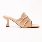 Khaki patent mules for women, a warm nude patent mule whose gathered instep band is split into three soft tiers by two slim raised straps, the lowest running diagonally across a wide square opening, on a slim flared spool heel in matching patent