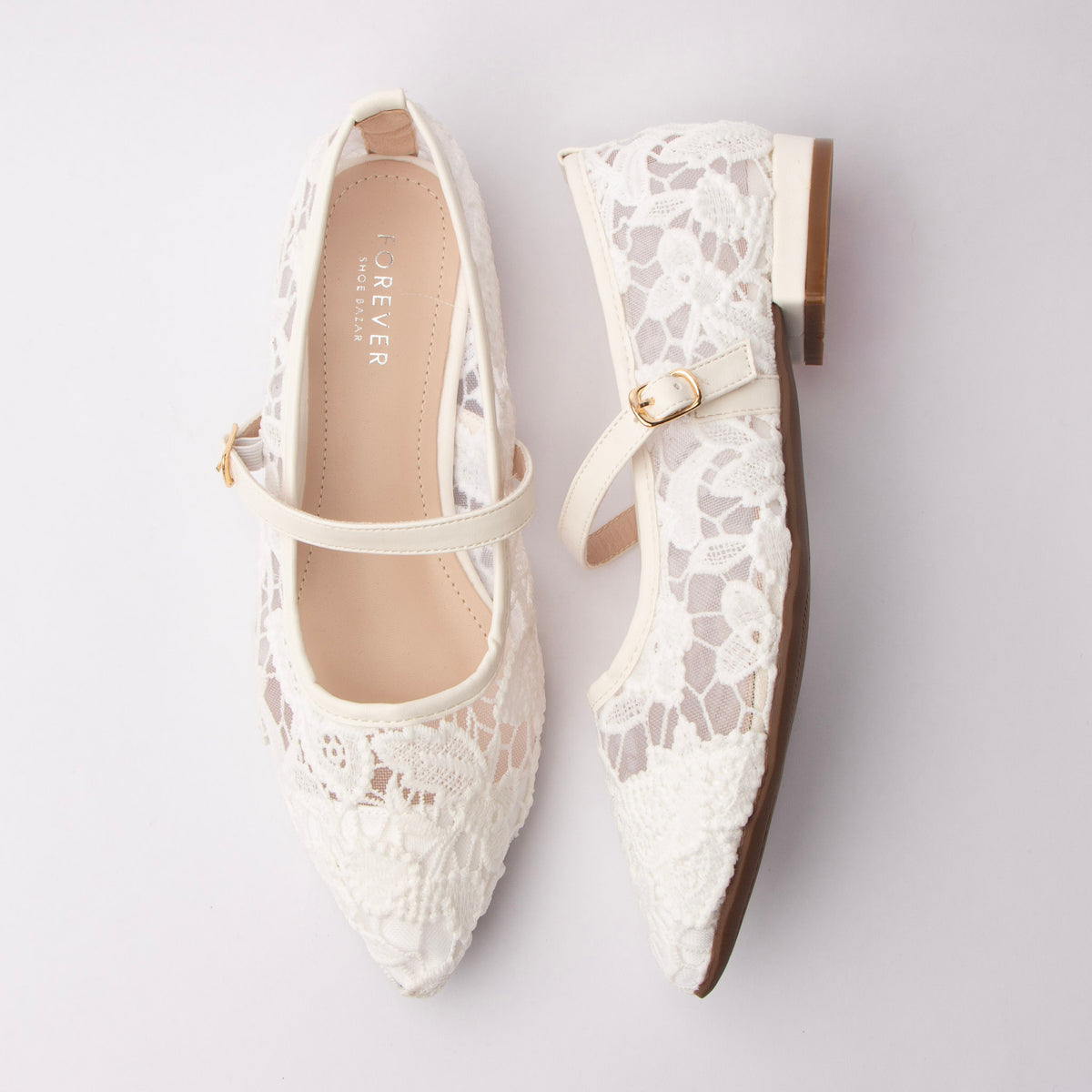 White Mary Janes for women, both shoes laid flat