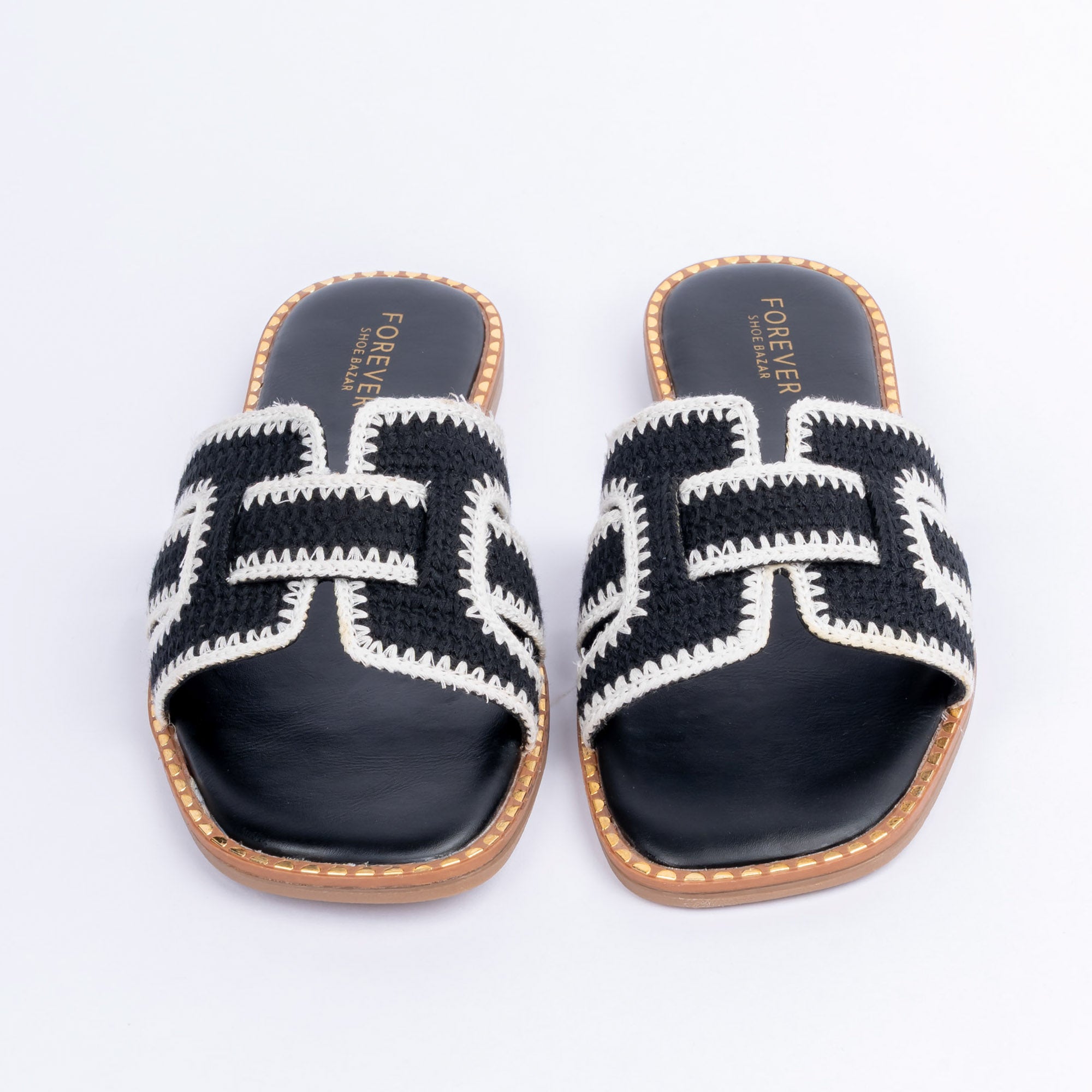 Black whipstitch ballet flats styled for everyday casual wear