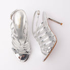 Silver sandals for women, both shoes laid flat