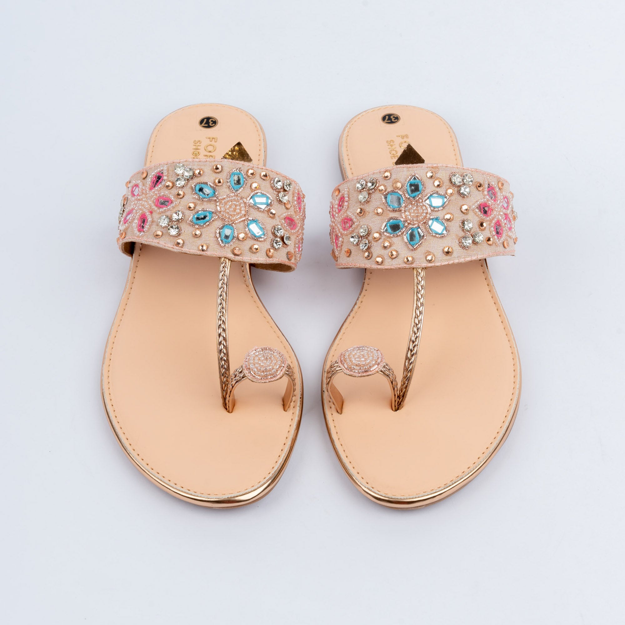 Champagne toe ring embellished flats styled for everyday casual wear