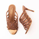 Brown mules for women, both shoes laid flat
