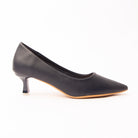 Navy blue pointed kitten heels for women, a deep navy pebble-grain court with a sharply pointed toe, the blue reading clearly in profile, on a glossy navy kitten heel tipped with a small clear block