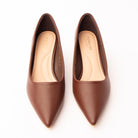 Brown pointed kitten heels styled for everyday wear