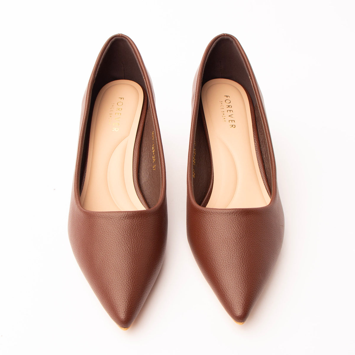 Brown pointed kitten heels styled for everyday wear