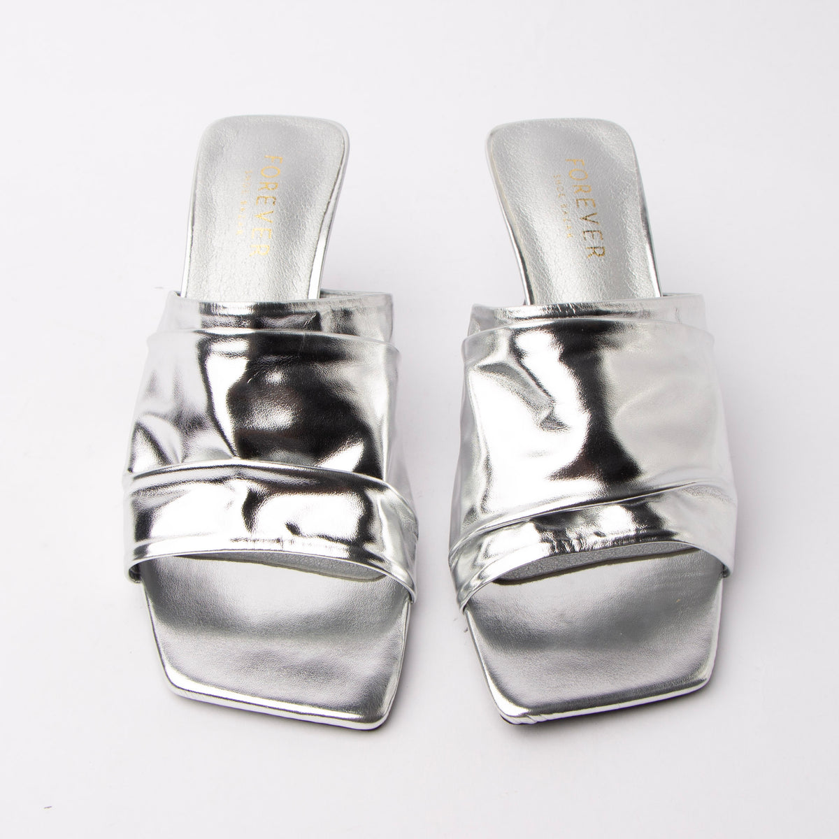Silver metallic mules styled for everyday wear