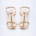 Gold block heel sandals styled for casual wear