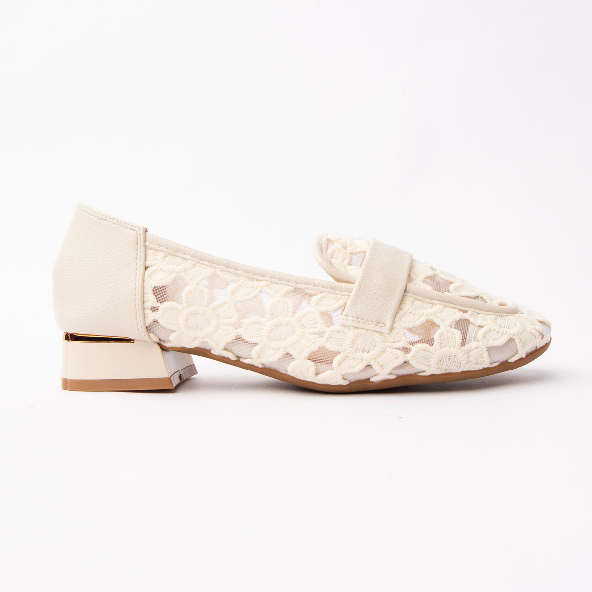 Beige lace loafers for women, ivory floral guipure lace embroidered onto sheer mesh so the daisy motifs sit against a see-through ground, banded across the vamp with smooth pale leather, on a low block heel ringed in gold over a tan-camel footbed
