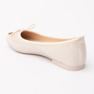 Cream patent ballerina flats for women, back view showing the heel counter