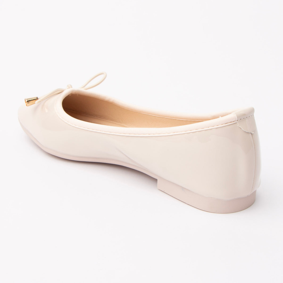 Cream patent ballerina flats for women, back view showing the heel counter