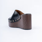 Black wedge heel mules for women with cushioned footbed, side view