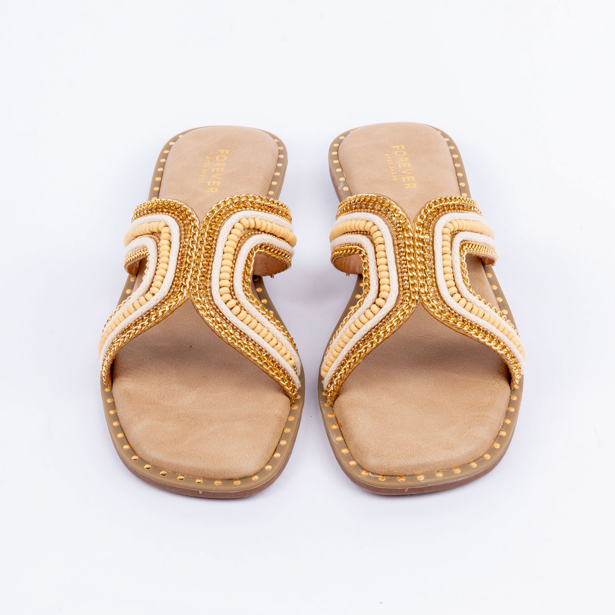 Beige beaded ballet flats styled for everyday casual wear