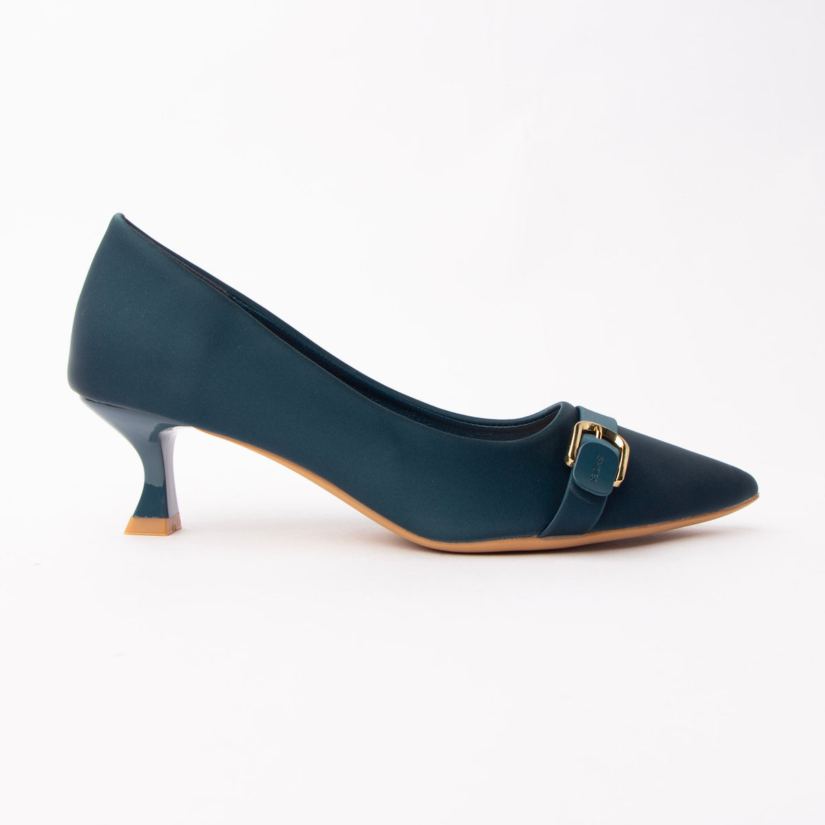 Blue buckle kitten heels for women, a deep teal-blue matte court with a gently scalloped topline, crossed by a narrow tonal band held in a small gold pin buckle, on a low flared kitten heel in glossy teal patent finished with a caramel tip