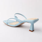 Blue mules for women, back view showing the heel