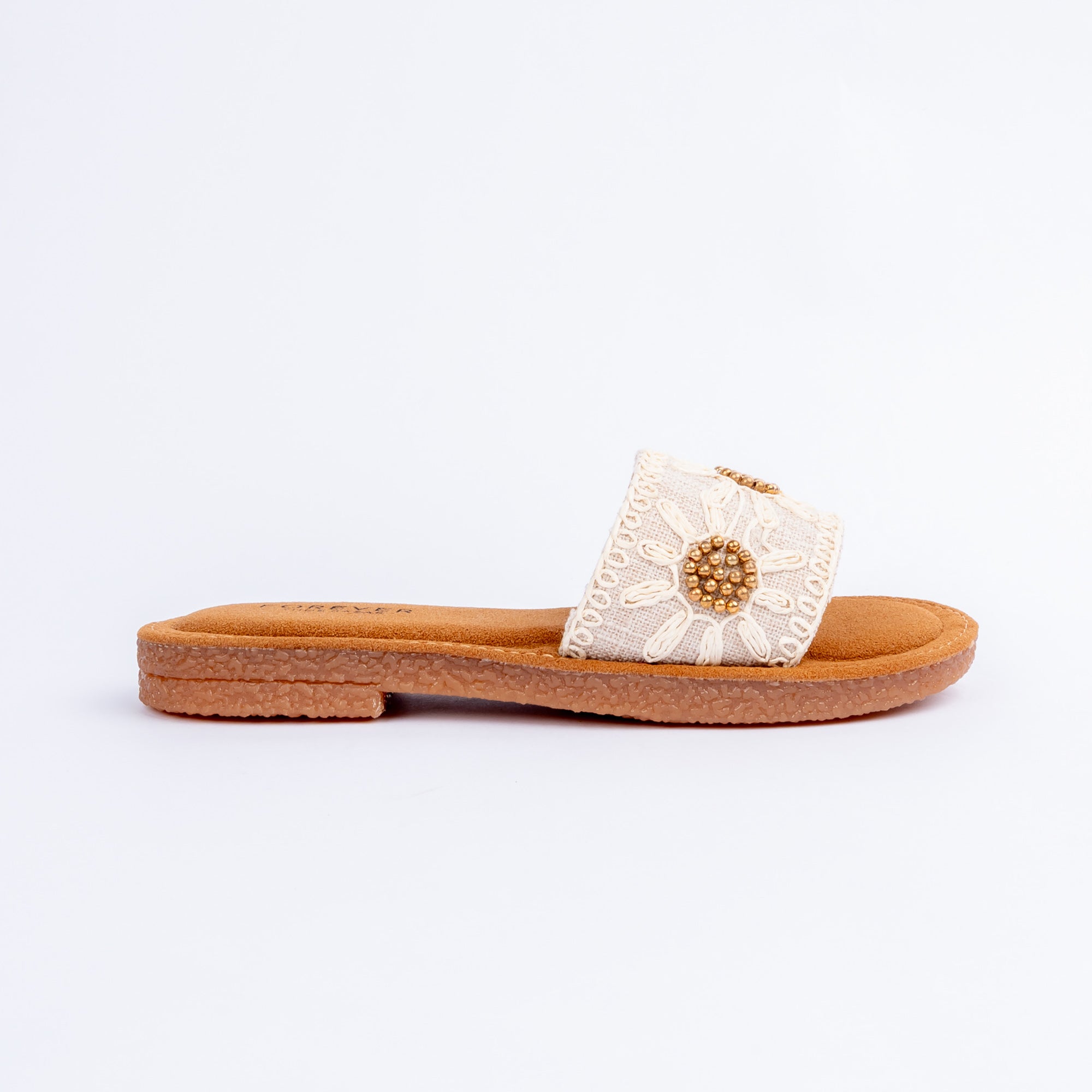 Beige flats for women with cushioned footbed, side view