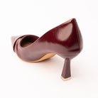 Maroon folded strap pumps for women, back view showing the heel
