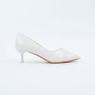 White pumps styled for casual wear