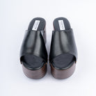 Black wedge heel mules styled for casual wear