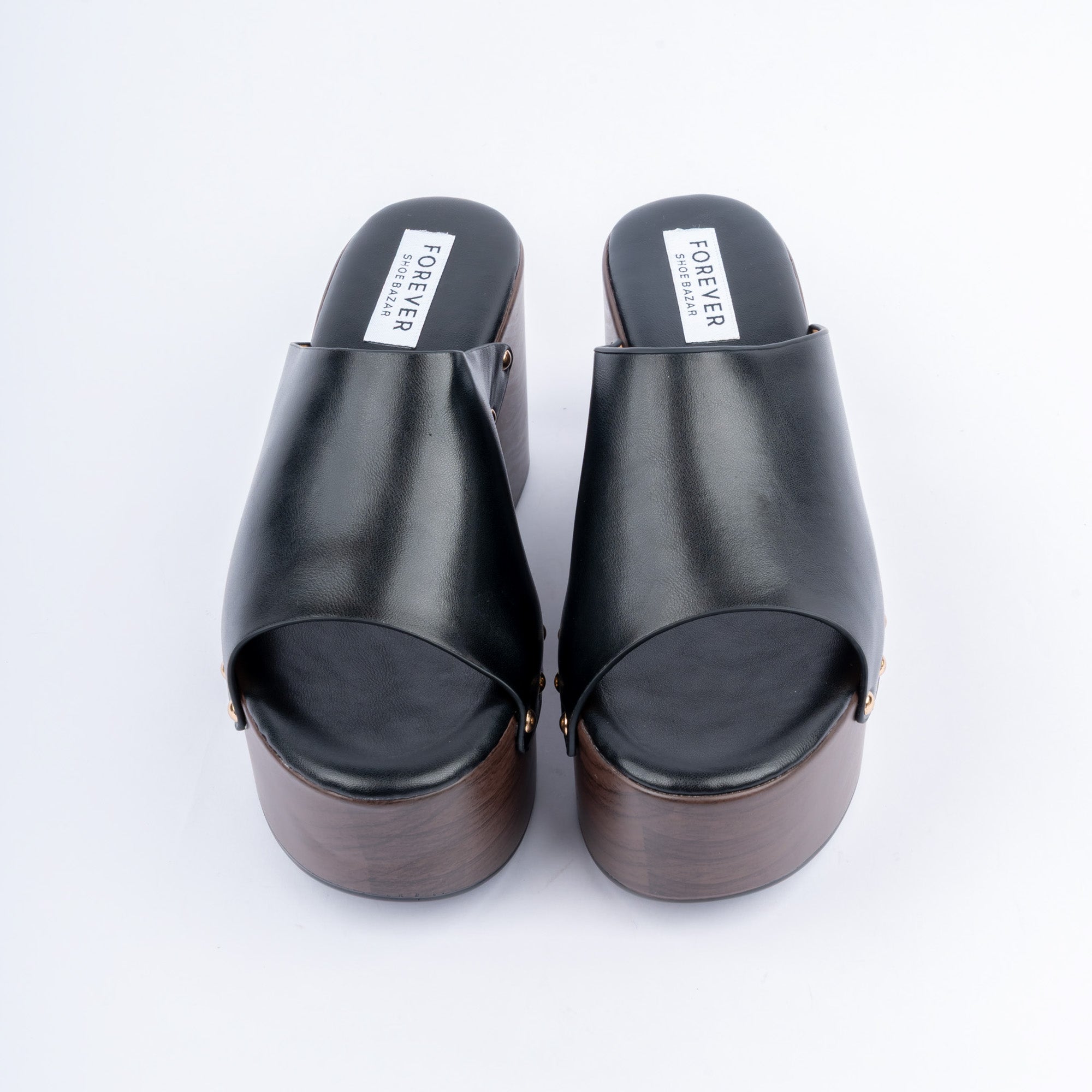 Black wedge heel mules styled for casual wear