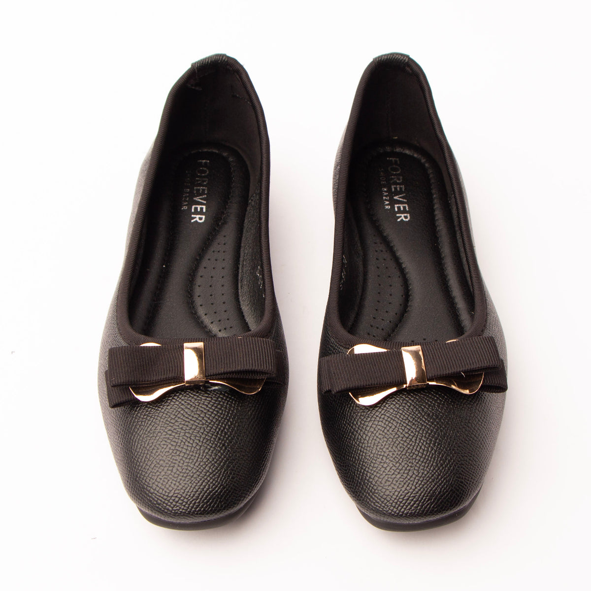 Black bow ballerina flats styled for everyday wear