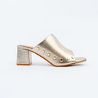 Gold block heel mules for women, a scalloped vamp edged with a curve of gold dome studs