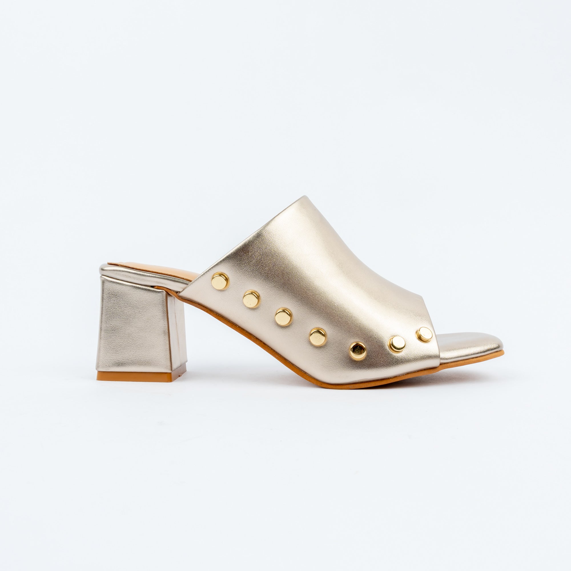 Gold block heel mules for women, a scalloped vamp edged with a curve of gold dome studs