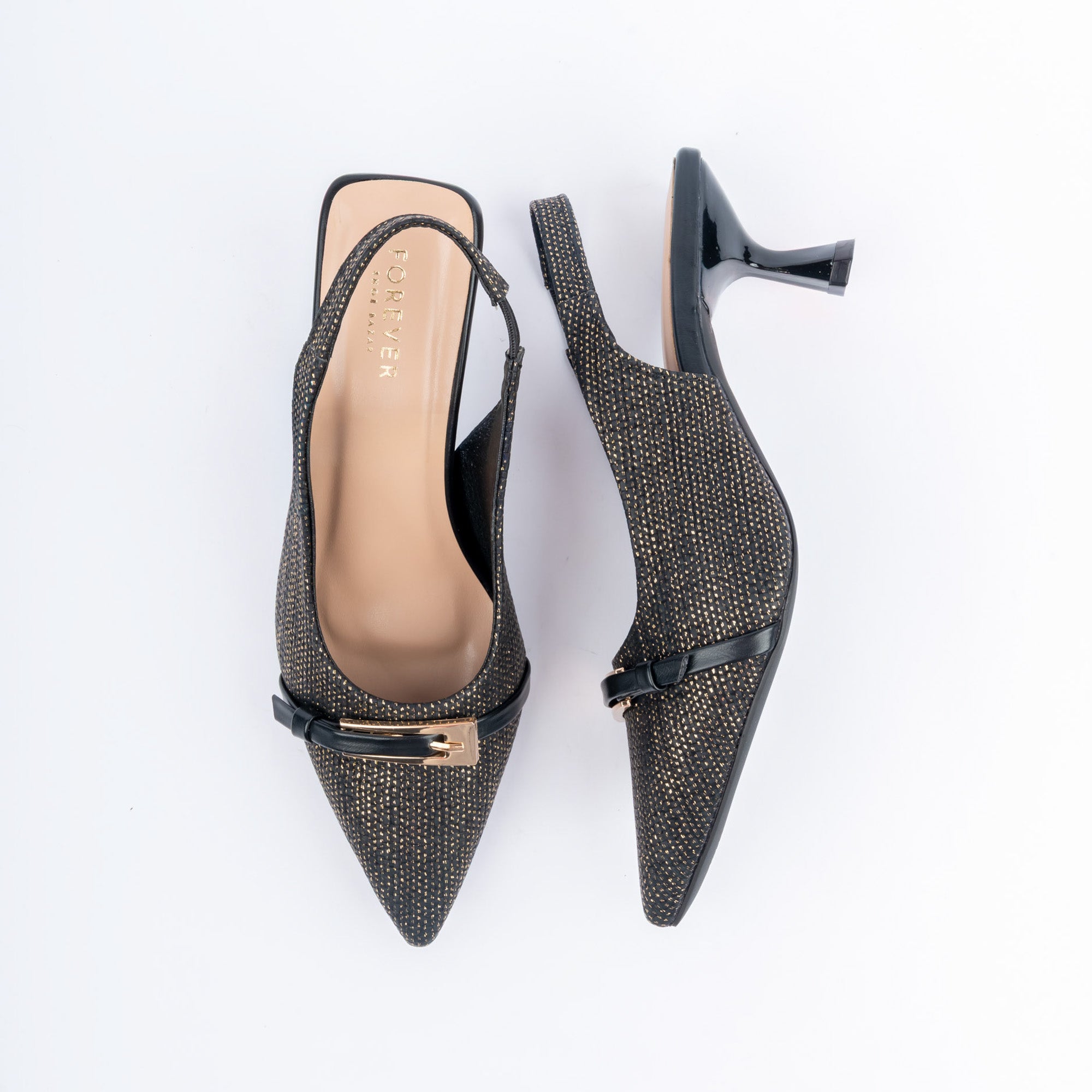 Black pumps for women, a shimmer-weave upper drawn to a sharp point, crossed at the vamp by a patent strap ending in a rectangular gold buckle plate, with a thin elasticated slingback