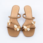 Beige slim heel mules styled for casual wear