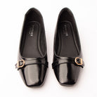 Black buckle ballerinas styled for everyday wear