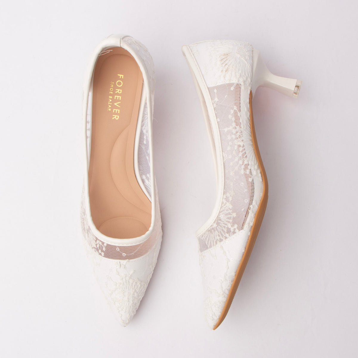 Beige embroidered mesh pumps for women, sheer mesh vamp carries ivory floral embroidery flecked with tonal sequins, bound at the topline with glossy ivory piping and set on a flared kitten heel over a nude cushioned footbed