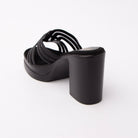 Black beaded platform mules for women with cushioned footbed, side view