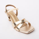 Gold kitten heel sandals styled for casual wear
