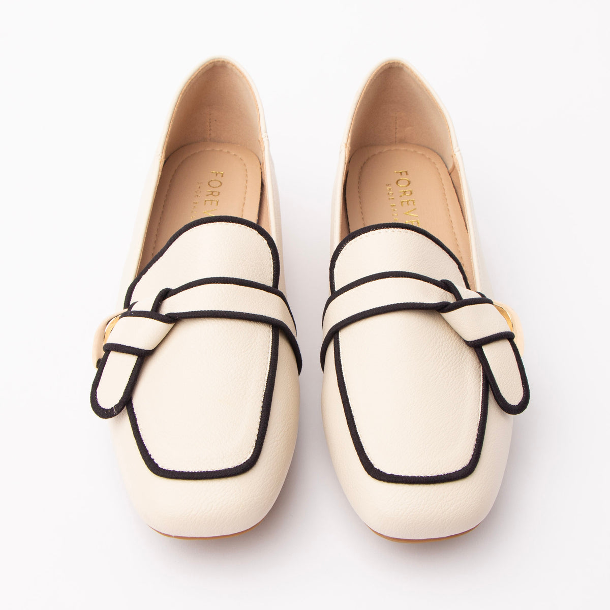 Beige piped block heel loafers styled for everyday wear