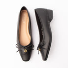 Black pumps for women, both shoes laid flat