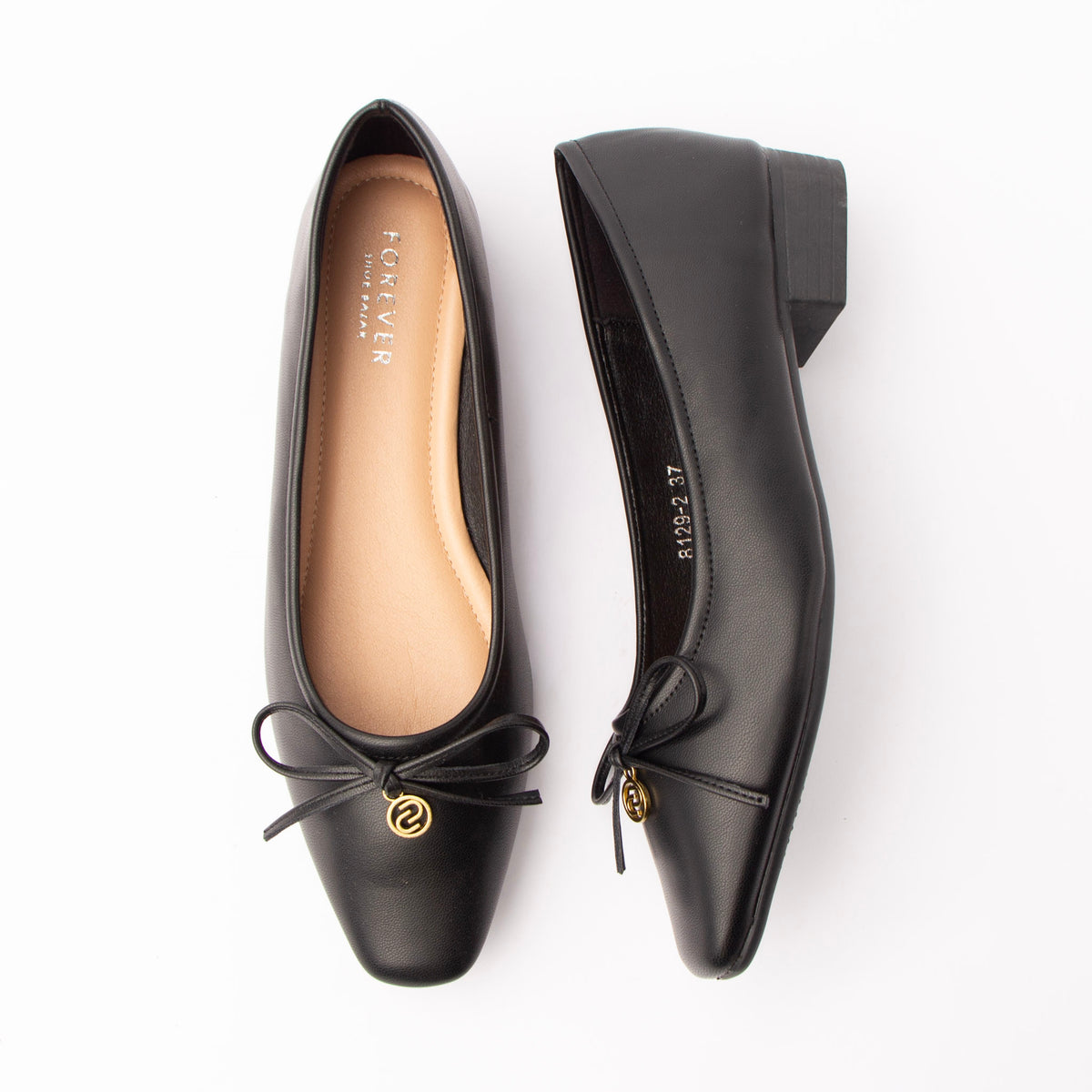 Black pumps for women, both shoes laid flat