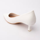 White pointed kitten heels for women, back view showing the heel