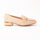 Beige woven loafers for women, a fine ecru basketweave upper worked cream on cream so the texture carries it, with a tonal sand leather vamp strap holding a beige cabochon in a gold bezel and a low block heel collared in gold