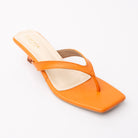Orange toe-post kitten heel mules for women, three-quarter view